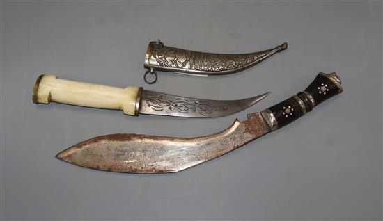 A kukri and an Eastern bone handled dagger